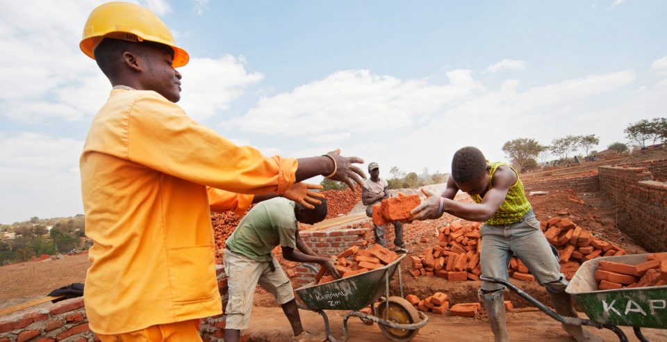 Construction workers at a build site in Malawi